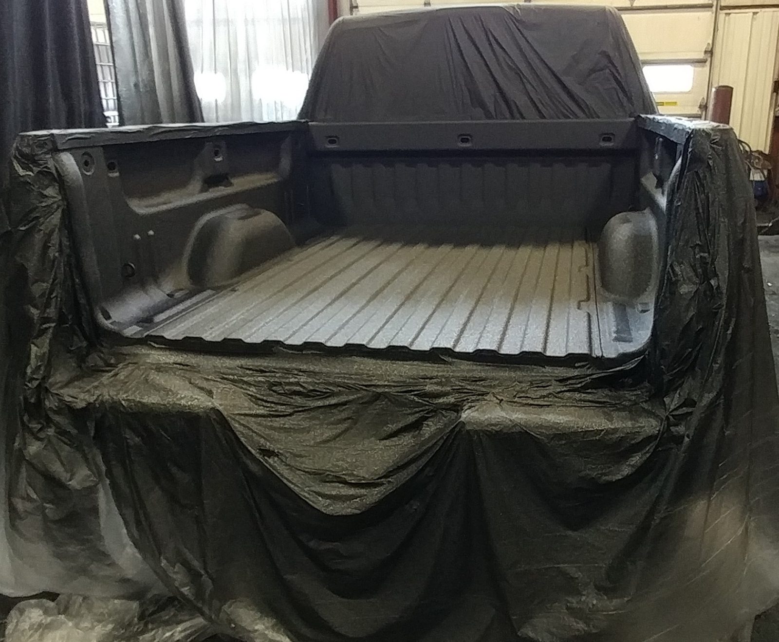 ArmorBond RP being spray-applied to metal